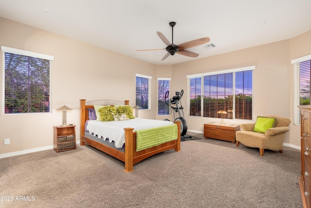 bedroom with baseboards, visible vents, ceiling fan, and carpet