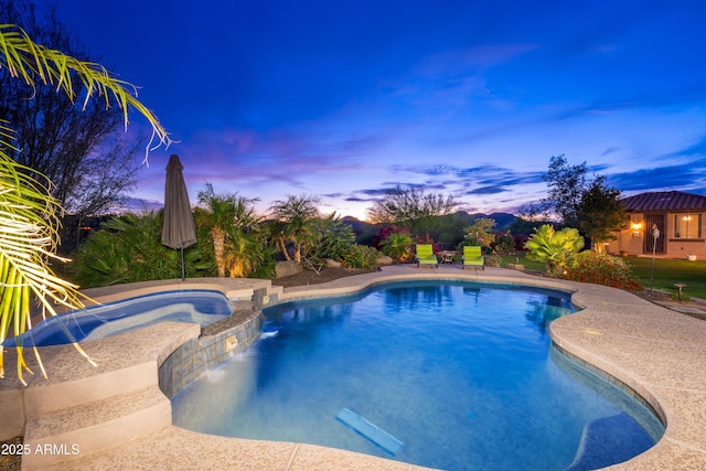 view of swimming pool featuring a pool with connected hot tub