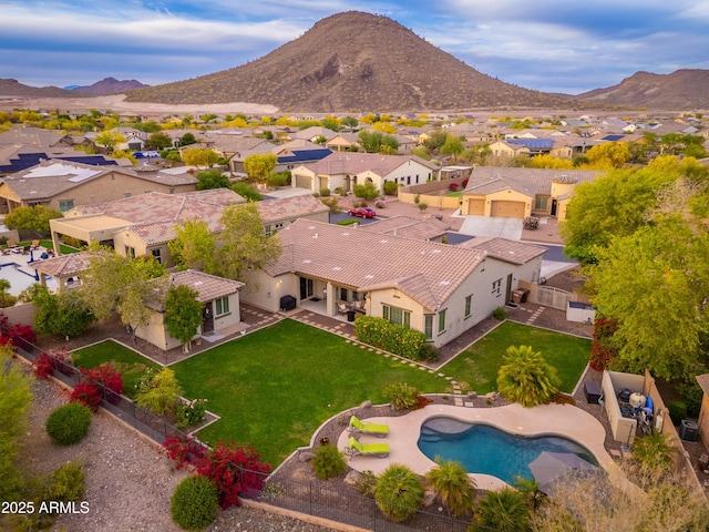 drone / aerial view with a residential view and a mountain view