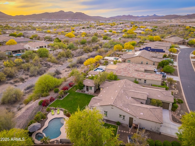 aerial view at dusk with a residential view and a mountain view