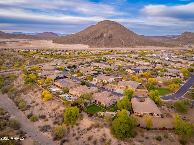 birds eye view of property featuring a mountain view and a residential view