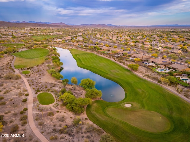 bird's eye view with a water and mountain view, golf course view, and a residential view