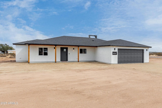 view of front facade featuring driveway and a garage