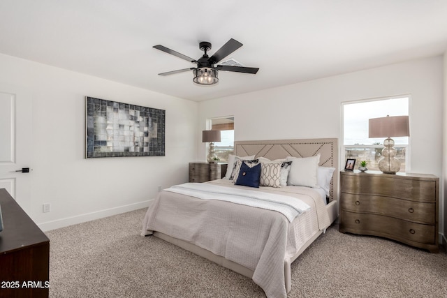 bedroom featuring baseboards, carpet floors, and ceiling fan
