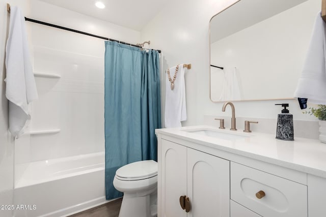 bathroom with toilet, vanity, shower / bath combo, wood finished floors, and recessed lighting