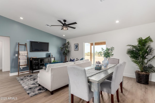 dining room with vaulted ceiling, a ceiling fan, light wood-type flooring, visible vents, and recessed lighting