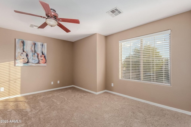 carpeted empty room with ceiling fan