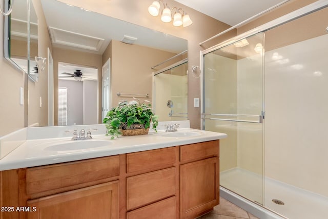 bathroom with vanity, a shower with shower door, tile patterned floors, and toilet