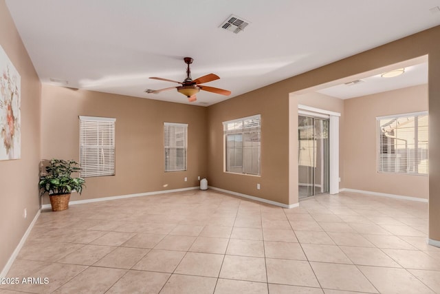 unfurnished room featuring light tile patterned flooring and ceiling fan