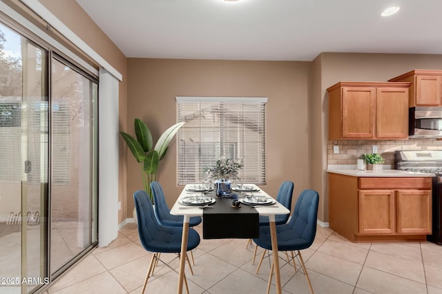 dining area featuring light tile patterned floors