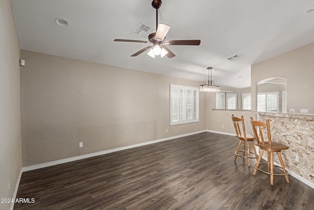 interior space featuring ceiling fan and dark wood-type flooring