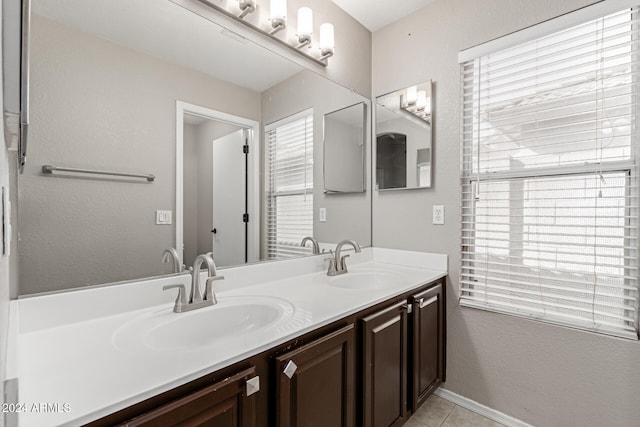 bathroom featuring tile patterned floors, a wealth of natural light, and vanity