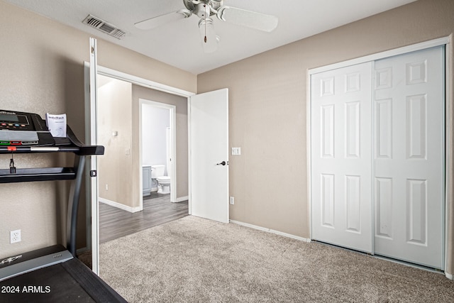 exercise area with carpet flooring and ceiling fan