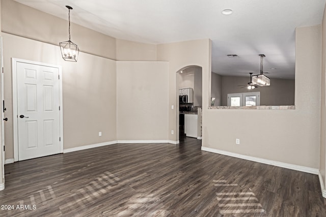 interior space featuring dark hardwood / wood-style floors, vaulted ceiling, and ceiling fan