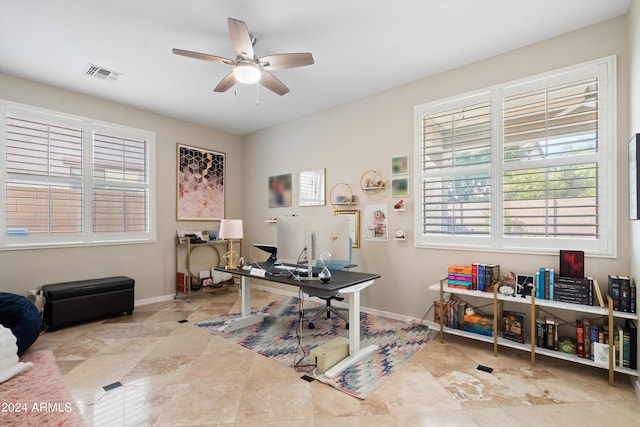 home office featuring baseboards, visible vents, and a ceiling fan