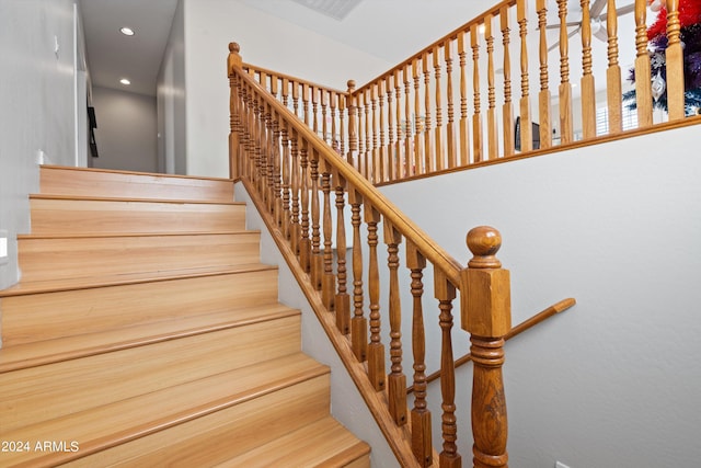 staircase featuring recessed lighting