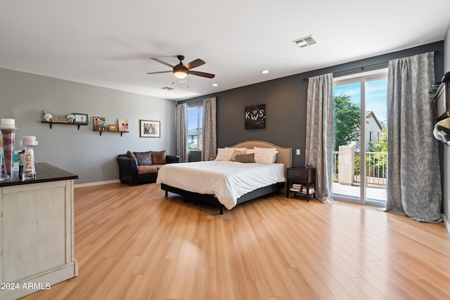 bedroom featuring light wood finished floors, visible vents, baseboards, a ceiling fan, and access to outside