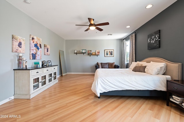 bedroom with recessed lighting, visible vents, ceiling fan, wood finished floors, and baseboards