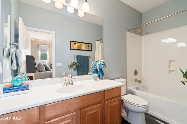 bathroom featuring shower / bath combo with shower curtain, vanity, toilet, and ensuite bathroom