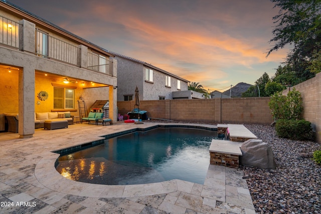 view of swimming pool with a patio, outdoor lounge area, a fenced backyard, and a fenced in pool