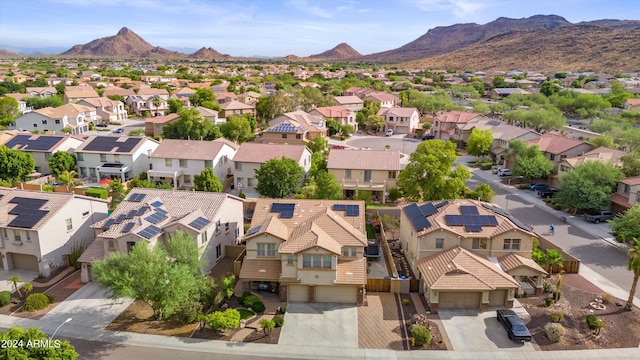 drone / aerial view with a residential view and a mountain view