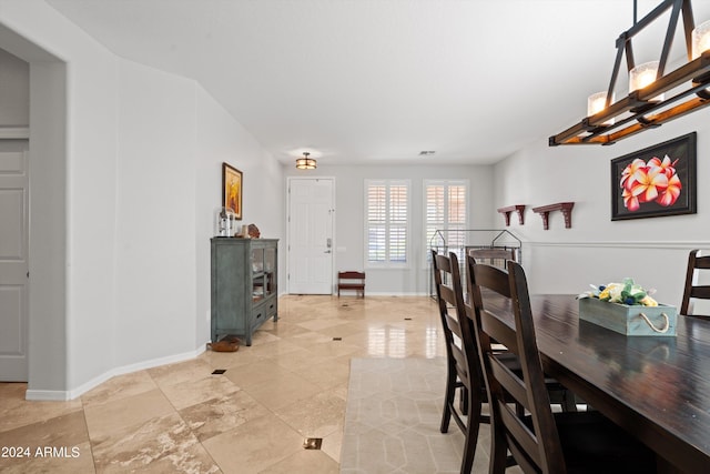 dining area featuring baseboards