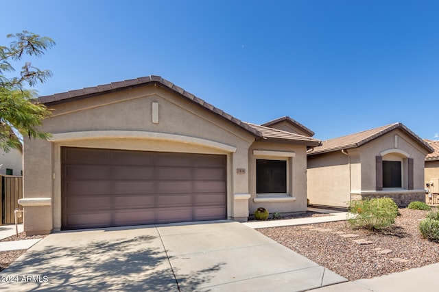 ranch-style home featuring a garage