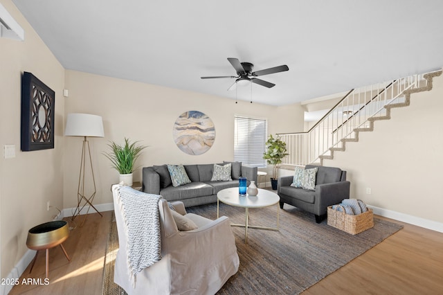 living room with ceiling fan and wood-type flooring