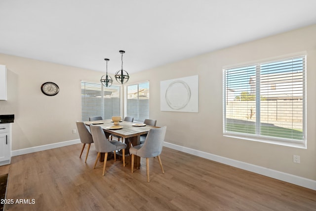 dining area with light hardwood / wood-style flooring