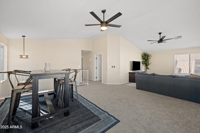 interior space with carpet flooring, ceiling fan, and lofted ceiling