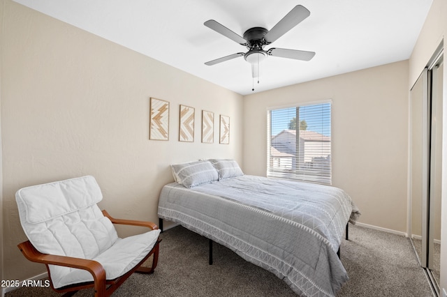 carpeted bedroom featuring ceiling fan and a closet