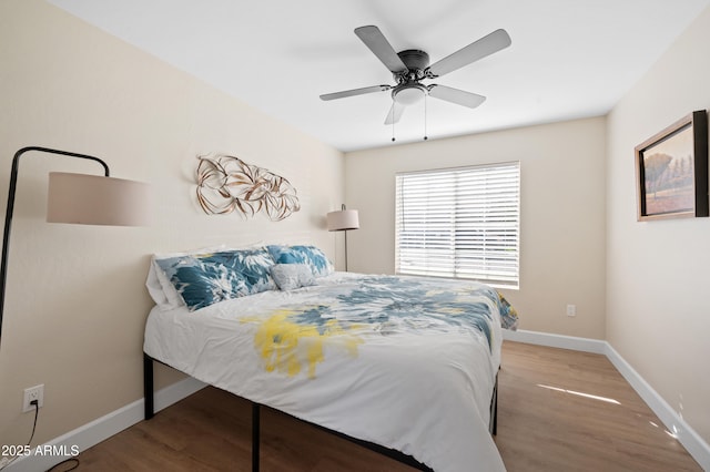 bedroom with hardwood / wood-style flooring and ceiling fan