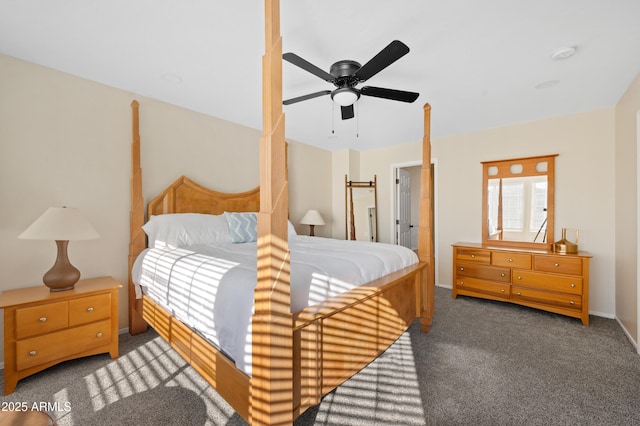 bedroom featuring ceiling fan and dark carpet