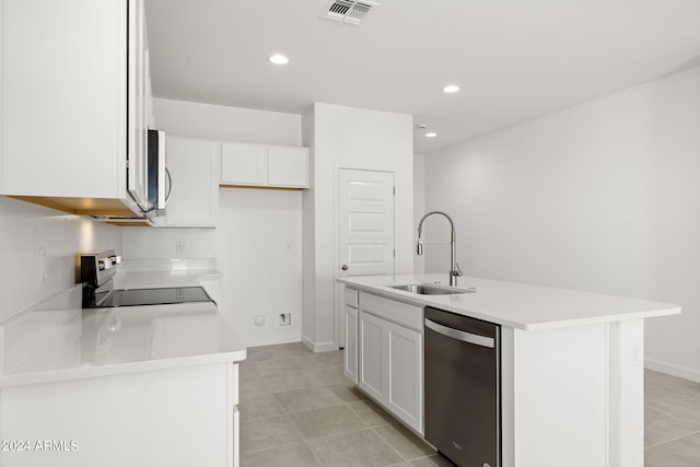 kitchen with white cabinets, sink, stainless steel appliances, and an island with sink