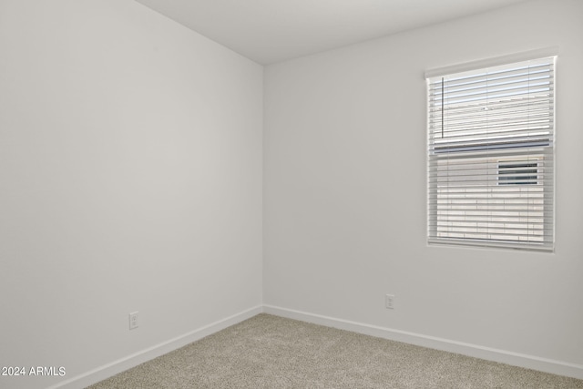 empty room featuring light colored carpet