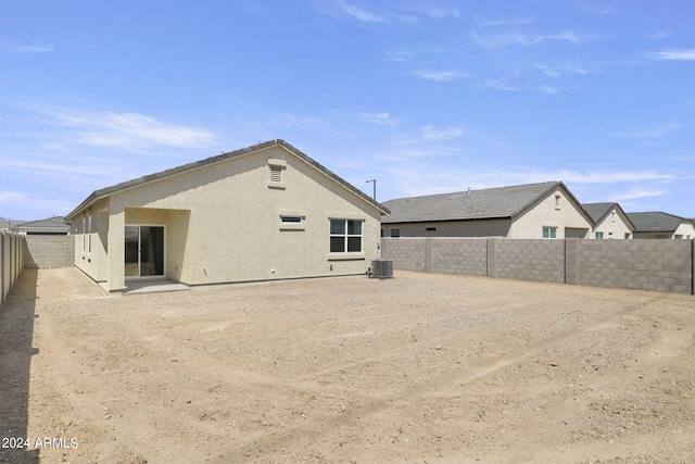 back of house featuring central AC