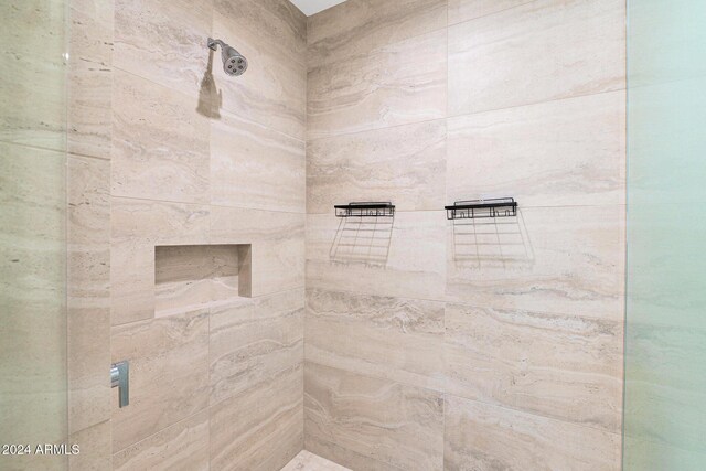 bathroom with tiled shower