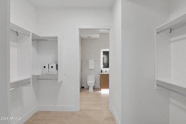 spacious closet featuring light tile patterned floors