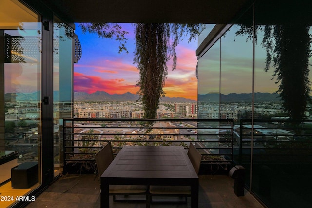 balcony at dusk with a mountain view