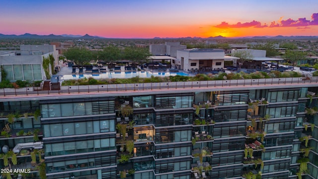 outdoor building at dusk with a mountain view