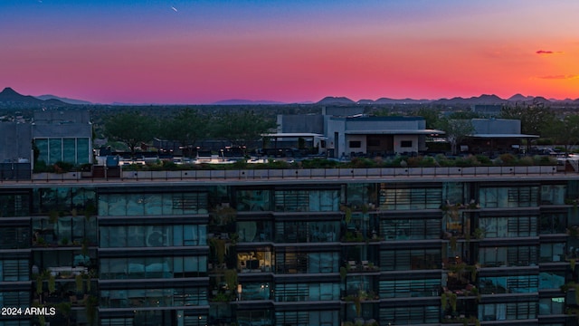 outdoor building at dusk with a mountain view