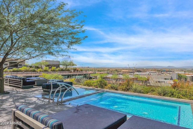 view of pool featuring a patio area and an outdoor living space