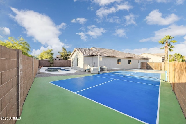view of sport court with a fenced backyard