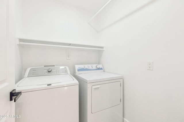 laundry area featuring laundry area and washer and dryer