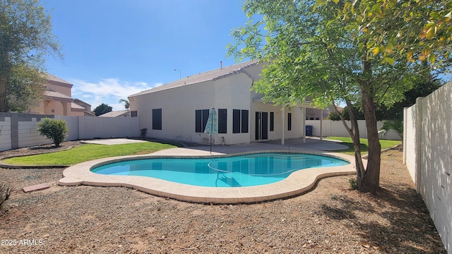 view of swimming pool featuring a fenced in pool, a patio area, and a fenced backyard