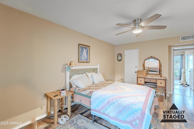 bedroom featuring ceiling fan and hardwood / wood-style flooring