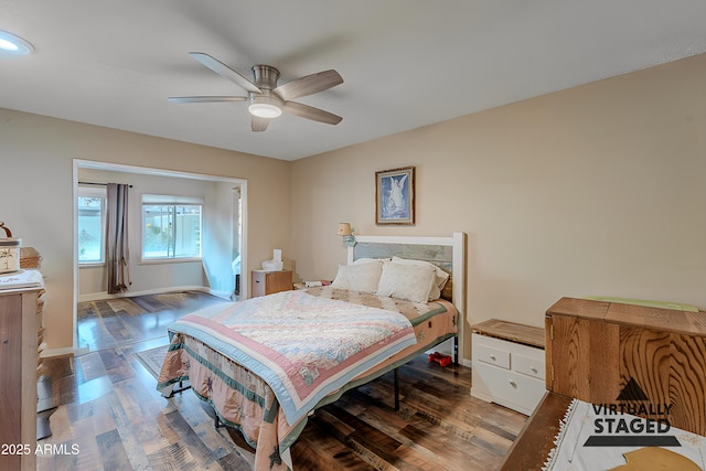 bedroom featuring hardwood / wood-style floors and ceiling fan