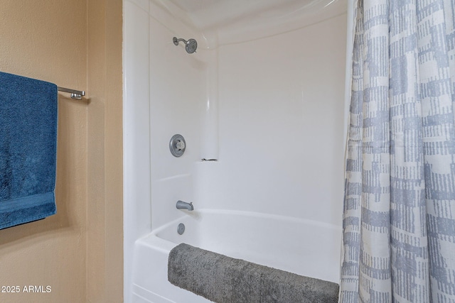 bathroom featuring shower / bath combo with shower curtain