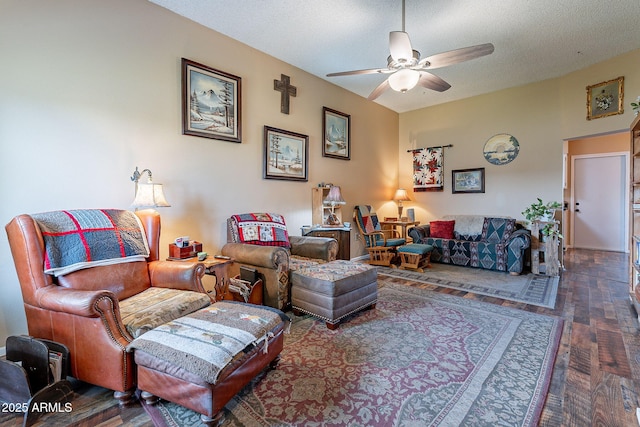 living room with ceiling fan, dark hardwood / wood-style flooring, and a textured ceiling