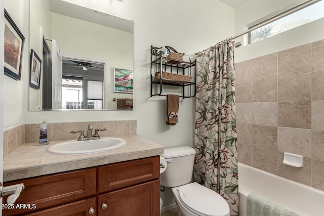 full bathroom with vanity, toilet, and shower / bath combo with shower curtain